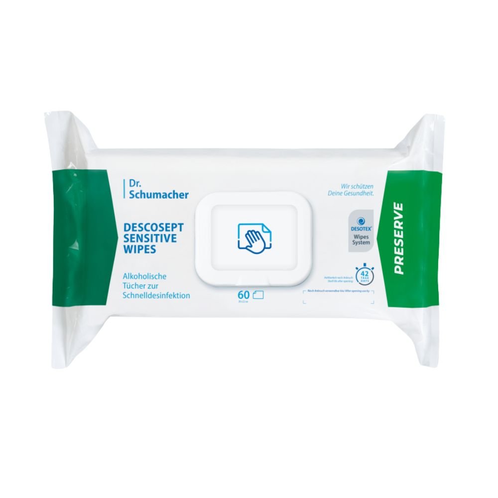 Egy csomag Dr. Schumacher Descosept Sensitive Wipes fertőtlenítő törlőkendő a Dr. Schumacher GmbH-tól a gyors fertőtlenítéshez. A címke jelzi, hogy alkoholalapú törlőkendőkről van szó, amelyek közepes méretű felületek fertőtlenítésére ideálisak. A csomag túlnyomórészt fehér, zöld díszítéssel, és 60 darab törlőkendőt tartalmaz.