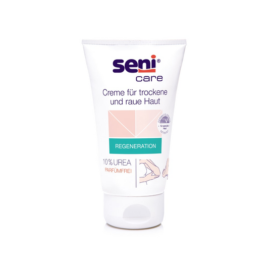 Eine 100-ml-Tube Seni Care Creme von TZMO Deutschland GmbH für trockene und raue Haut hat einen weißen Hintergrund mit hellrosa und grünen Akzenten. Das Etikett weist auf 10 % Urea hin, ist parfümfrei, erhöht den Feuchtigkeitsgehalt und enthält eine deutsche Anleitung.