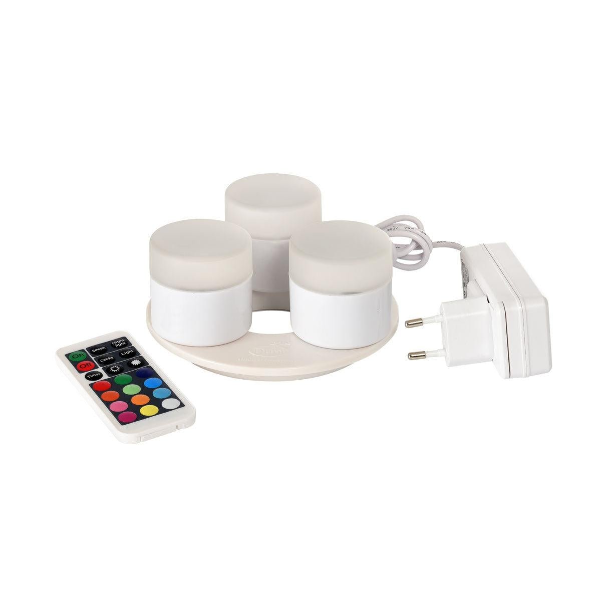 A Duni GmbH Mini Multicolour LED készlet három kis, kerek LED-et tartalmaz egy töltőállomással, egy fehér tápegységgel és egy távirányítóval különböző színekhez és funkciókhoz - tökéletes kreatív világításhoz.