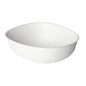 Egy egyszerű, fehér, ovális eldobható pohár (Bowls Pebble 500 ml - bevonat nélküli fehér bagasse 150x130x50 a Duni GmbH-tól, 50 darabos csomag), enyhén strukturált felülettel, fehér háttér előtt fényképezve.