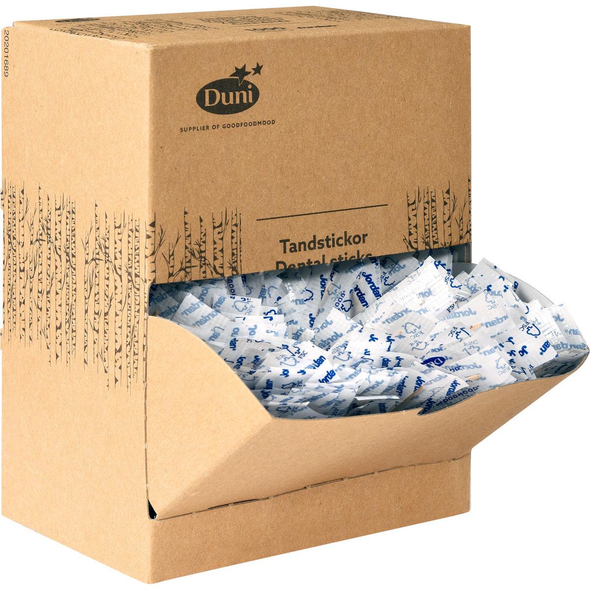 Egy barna karton adományozó doboz a "Duni GmbH Zahnstocher Neutral Holz 50 | Packung (1000 Stück)" felirattal külön csomagolt fa fogpiszkálókat tartalmaz fehér és kék csomagolásban, amelyek közül néhány a nyitott elülső fedélen keresztül látható.