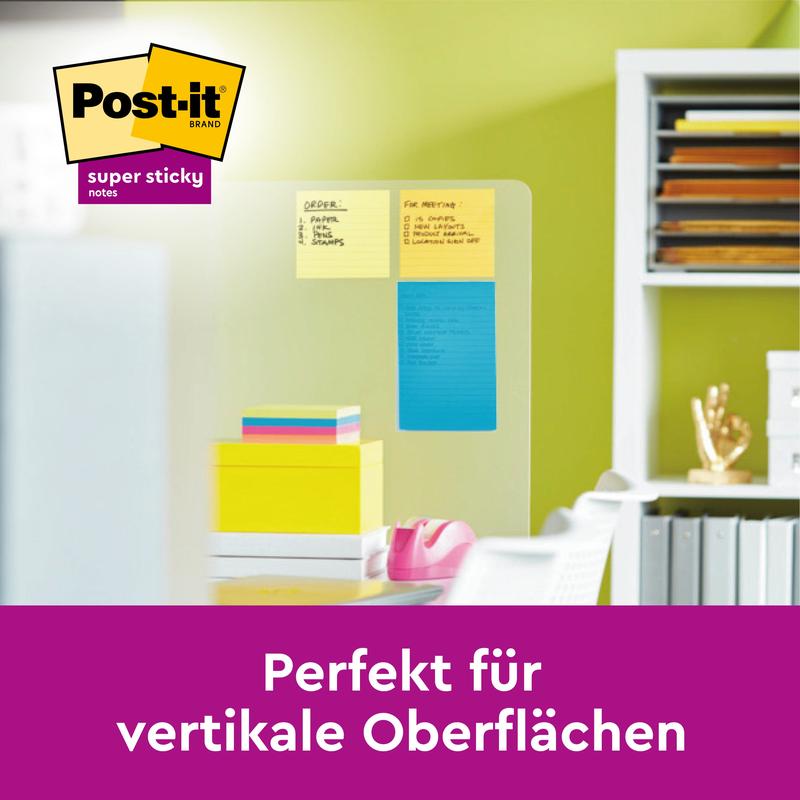 Három Post-it® Super Sticky Notes nagy méretben (sárga, narancs, kék) a 3M Deutschland GmbH-tól egy üvegfalon ragad. A német szöveg azt mondja: "Tökéletes függőleges felületekhez az extra erős ragasztóerőnek köszönhetően."