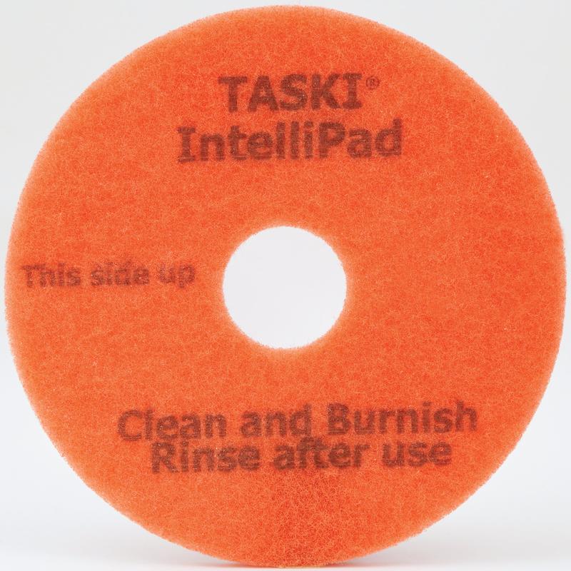 Das TASKI Intellipad Kombiniertes Reinigungs- und Polierpad für Unterhaltsreinigung von Diversey Deutschland GmbH & Co. OHG reinigt und poliert Böden effektiv - mit Markierung "This side up, Clean and Burnish, Rinse after use" und mittlerer Lochung.