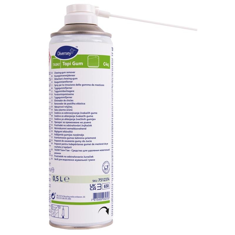 Egy 500 ml-es TASKI Tapi Gum rágógumi eltávolító spray a Diversey Deutschland GmbH & Co. OHG-tól, teljesen felszerelve szórófejjel és többnyelvű útmutatóval, fehér alapon áll - ideális rágógumik eltávolítására padlóról és más felületekről.