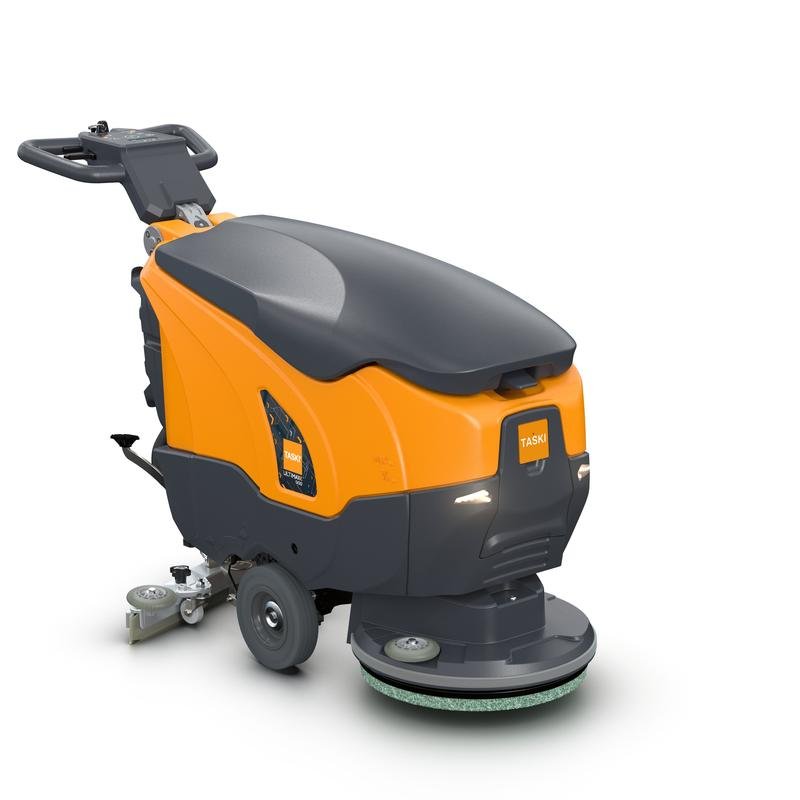 A TASKI ULTIMAXX 900 SD43 BMS 13A a Diversey Deutschland-tól egy újfajta, hajtás nélküli súroló-szívógép 20L-es tartállyal és 43 cm-es egytárcsával, narancs/fekete színben ábrázolva kormányrúddal és kerekekkel fehér háttér előtt.