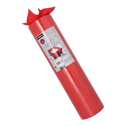 Egy Starpak asztali futó tekercs, anyagszerű textil „soft selection“ (24 m x 40 cm), függőlegesen áll. A címkén termékinformációk és csomagolt ajándékok láthatók, miközben a puha futó felül részben letekeredett.