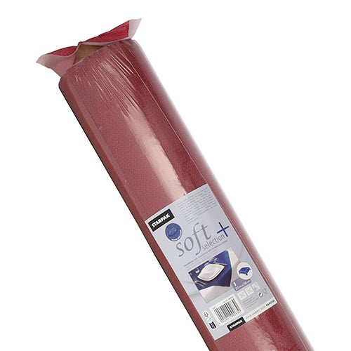 Egy tekercs Starpak asztalterítő, szövethez hasonló, "soft selection plus" vlies műanyag csomagolásban, termékinformációkkal és képekkel, amelyek stílusos, tartós használatát mutatják - hasonlóan egy egyszer használatos szövetasztalterítőhöz.