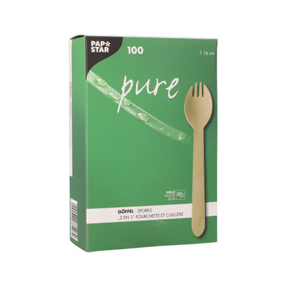 Egy zöld doboz a PAPSTAR GmbH-tól, "pure" felirattal, 100 környezetbarát fa-gőffelt (16 cm) tartalmaz egy kartontálcában, többnyelvű márkajelzéssel és termékinformációkkal, és fenntartható alternatívát kínál a hagyományos eszközökkel szemben.