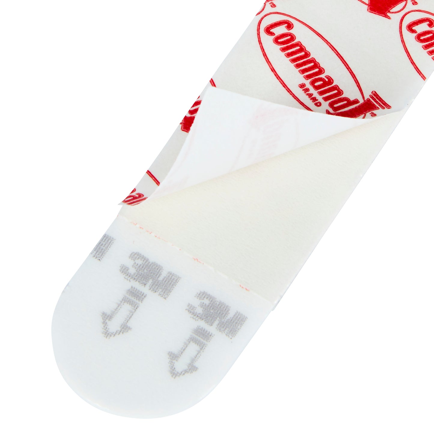 Eine Nahaufnahme eines Multipacks Command™ Strips, 17200 von 3M Deutschland GmbH mit teilweise abgezogener Schutzfolie, die die Klebefläche und die aufgedruckte Anleitung für Bilder aufhängen - die perfekten Klebestreifen ohne Bohren zeigt.