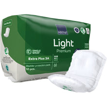 Abgebildet ist eine grüne Packung ABENA Light Extra Plus 3A, Premium der Abena Re-Seller GmbH (10 Stück) mit einem weißen Block auf der Vorderseite. Die Verpackung hebt verschiedene Produktsymbole hervor.