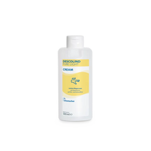 Egy fehér, 500 ml-es műanyag flakon Dr. Schumacher GmbH Descolind Pure Light Cream ápolókrém, illatmentes érzékeny bőrre, sárga címkével és kék felirattal, egy egyszerű fehér háttér előtt van lefotózva.