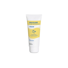 Egy 100 ml-es tubus Dr. Schumacher Descolind Pure intenzív krém a Dr. Schumacher GmbH-tól, egy illatmentes intenzív ápolókrém érzékeny és száraz bőrre sárga-fehér címkével, áll függőlegesen egy fehér háttér előtt.