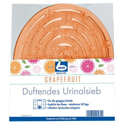 Aromás, grapefruit illatú piszoárrostély a(z) Dr. Becher GmbH-tól, narancssárga, kerek szőnyeggel, amely egy átlátszó előlap mögött látható. A címke gyümölcsillusztrációkat és egy német szöveget tartalmaz, amely leírja