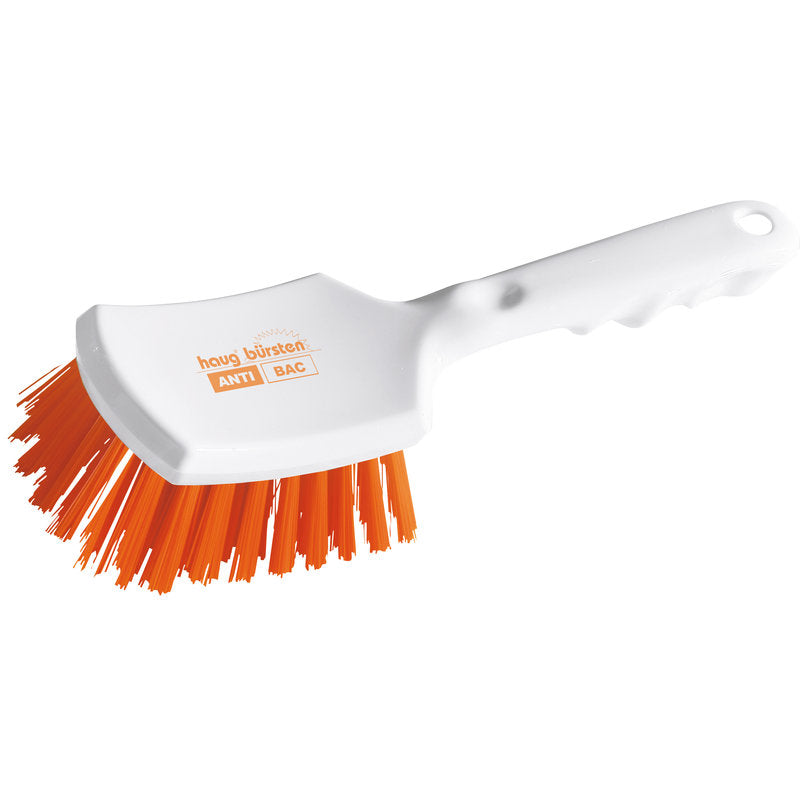 Haug Bürsten KG ANTI BAC nyeles kefe fehér műanyagból, enyhén ívelt nyéllel és merev narancssárga PBT-sörtékkel (ø 0,50 mm), amelyek súrolásra szögeltek. A kefefejre az "ANTI BAC" és a "Haug Bürsten" van nyomtatva. Méret: 260x72x35mm.