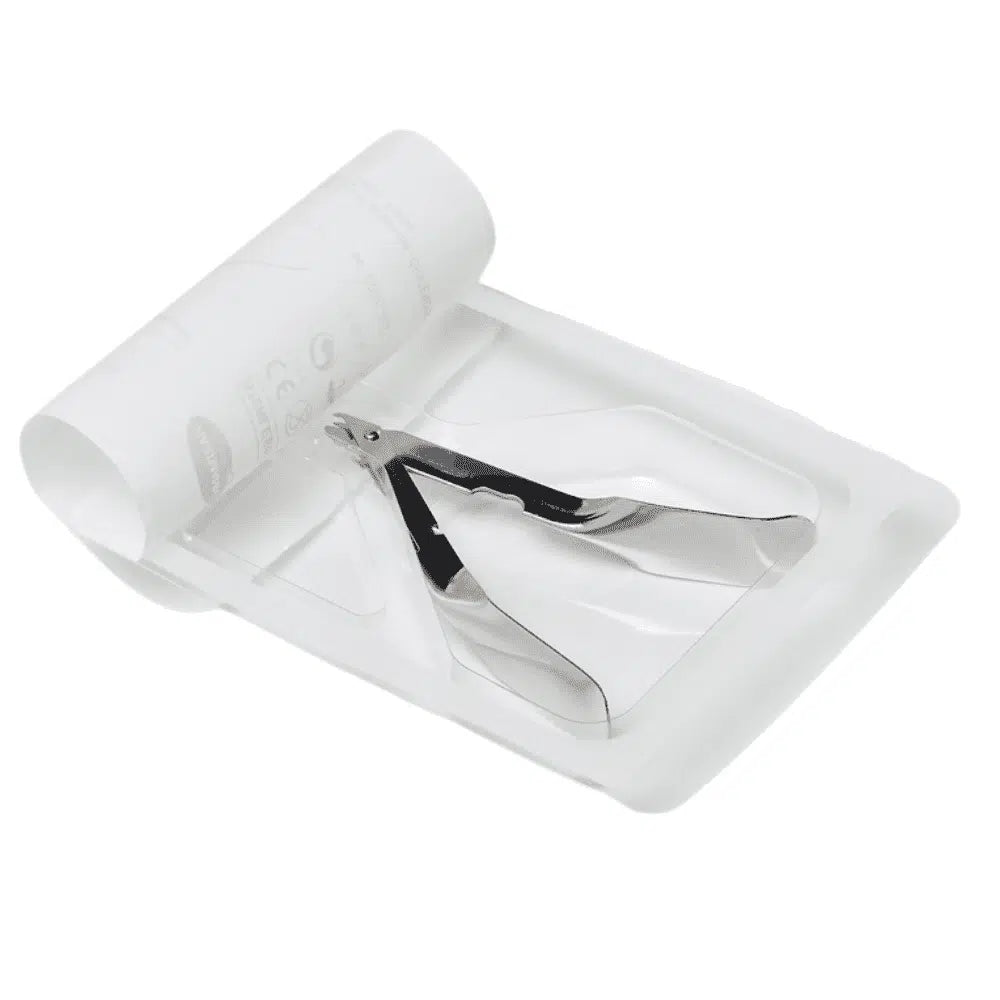 A kifutó cikk: a Paul Hartmann AG 10 cm-es Hartmann kapocskiszedője egy fehér eldobható tálcán fekszik egy mellette lévő feltekert papírlappal, ami az orvosi vagy manikűr területen való használatra utal. (Csomagolás: 1 darab).