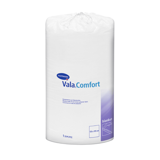 A Paul Hartmann AG gyártmányú, lezárt, fehér tekercsben lévő Hartmann Vala®Comfort takaró, fehér háttér előtt ábrázolva. A címkén a termék adatai és méretei (155 x 210 cm) szerepelnek.
