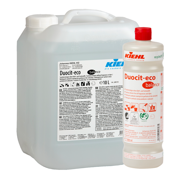 Egy 10 literes átlátszó kannát és egy 1 literes fehér palackot Kiehl Duocit-eco balance szaniter tisztítószer illat- és színezékmentes a Johannes Kiehl KG-tól, mindkettő piros kupakkal és használati és biztonsági utasításokkal feliratozva.