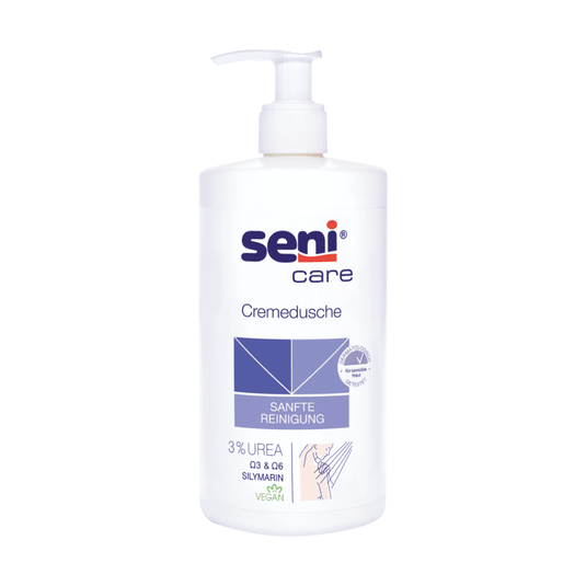 A Seni A TZMO Deutschland GmbH Care krémes tusfürdője, 500 ml, 3%-os karbamidot, szilimarinot és vegán összetételt tartalmaz. A fehér flakon pumpás adagolóval rendelkezik, és a „GYENGÉD TISZTÍTÁS” feliratú kék grafikával van ellátva; ideális a száraz bőr számára.