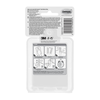 Die Rückseite einer Command™ Mini-Haken, transparent, mit transparenten Strips, 17006CLRFGN Packung von 3M Deutschland GmbH zeigt bebilderte Aufbewahrung ohne Bohren Schritte, Barcode, Branding, Website-Infos & einfache Gebrauchsanweisungen.